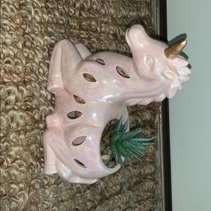 Unicorn with fake plant decoration